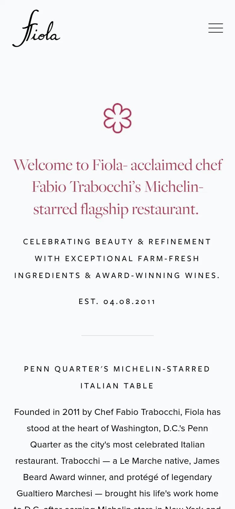 Fiola DC restaurant website on a phone with its script logo and welcome text